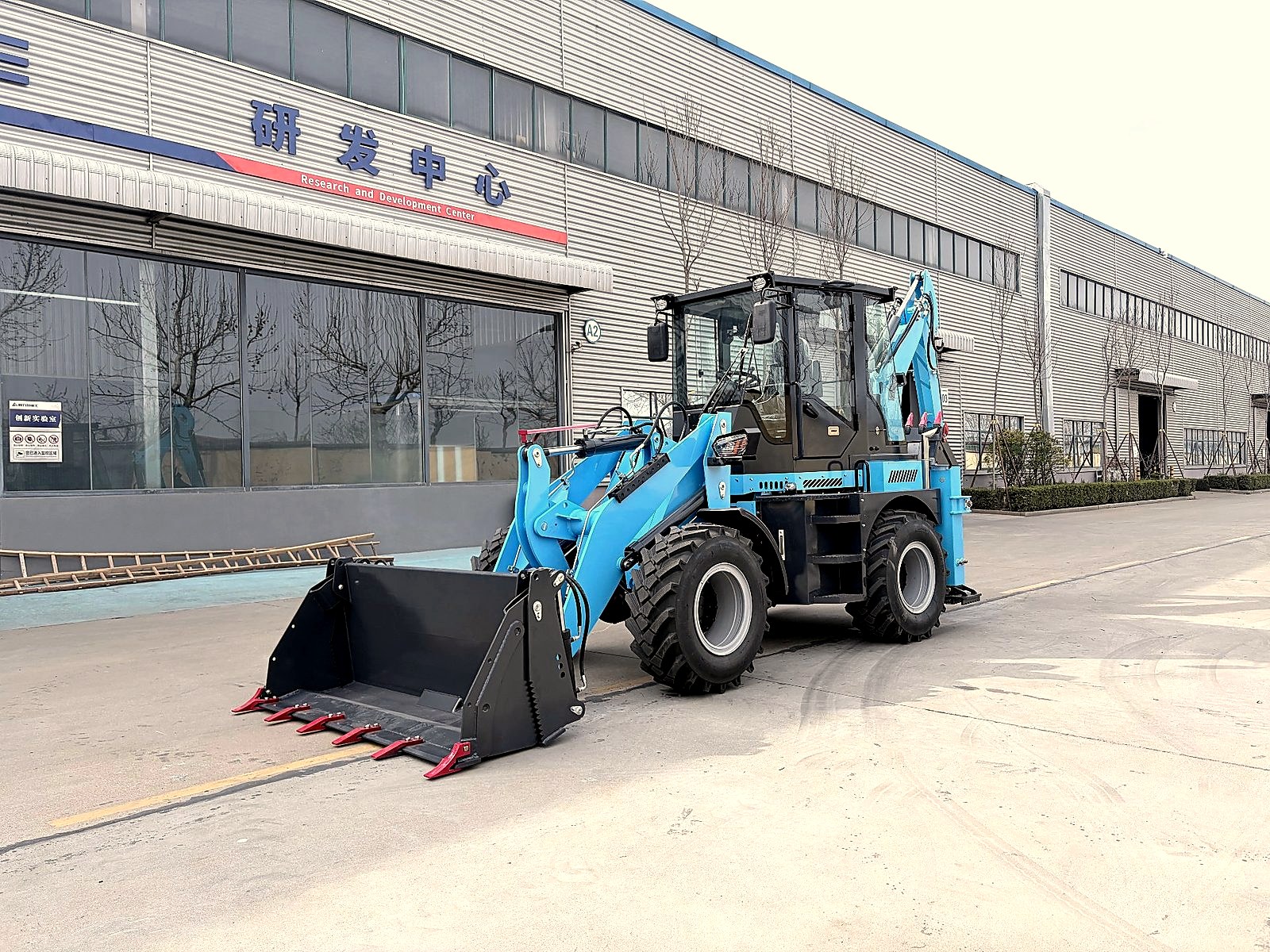 Backhoe loader refueling on a construction site