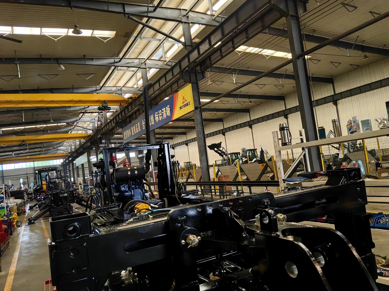 Backhoe loader assembly line in the workshop