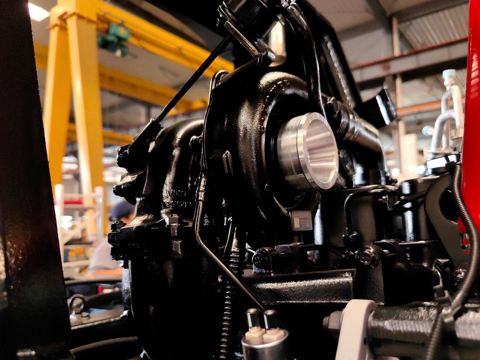 Turbocharger and engine details close-up — backhoe loader
