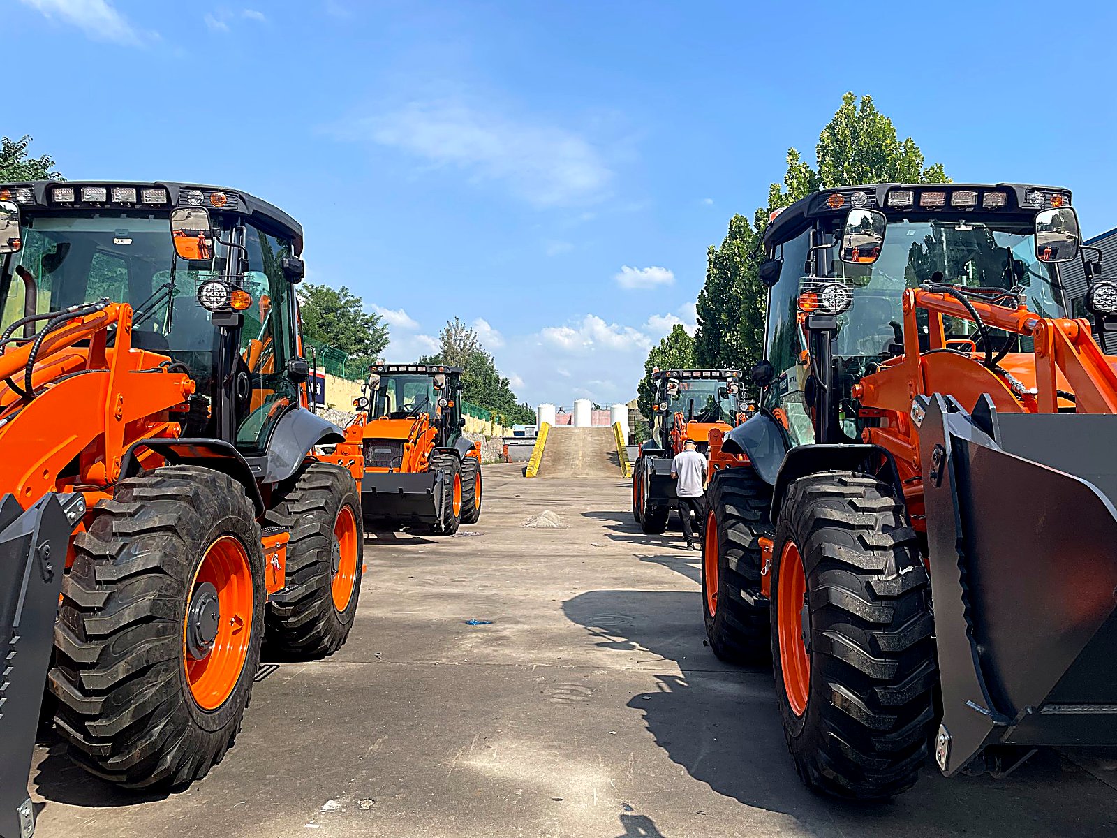 Quality control inspection of a backhoe loader before factory dispatch