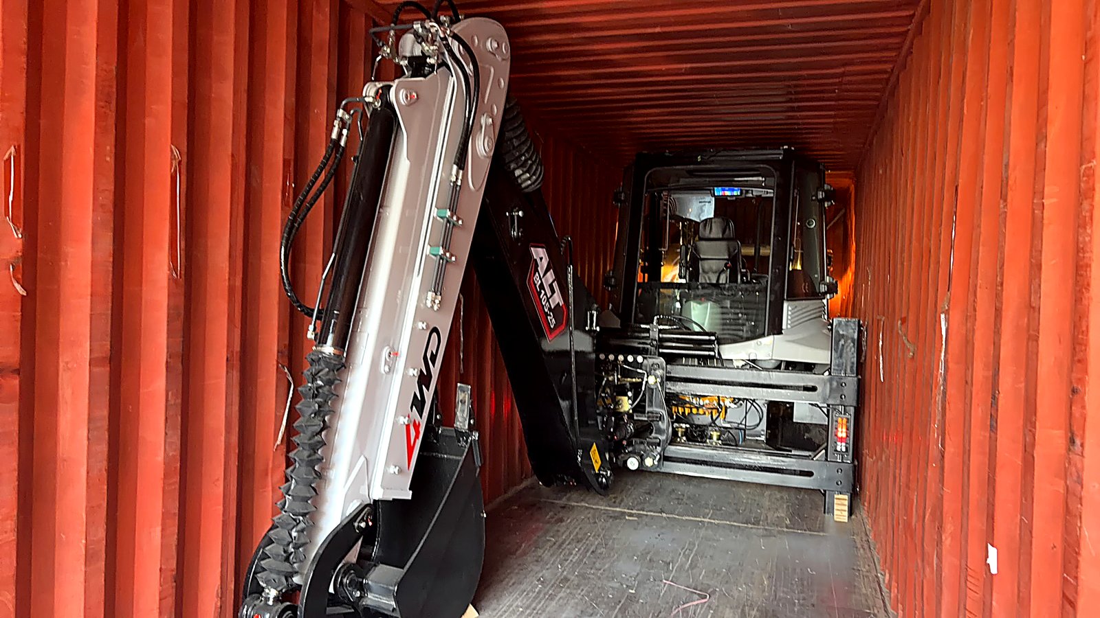 Backhoe loader shipping and container loading