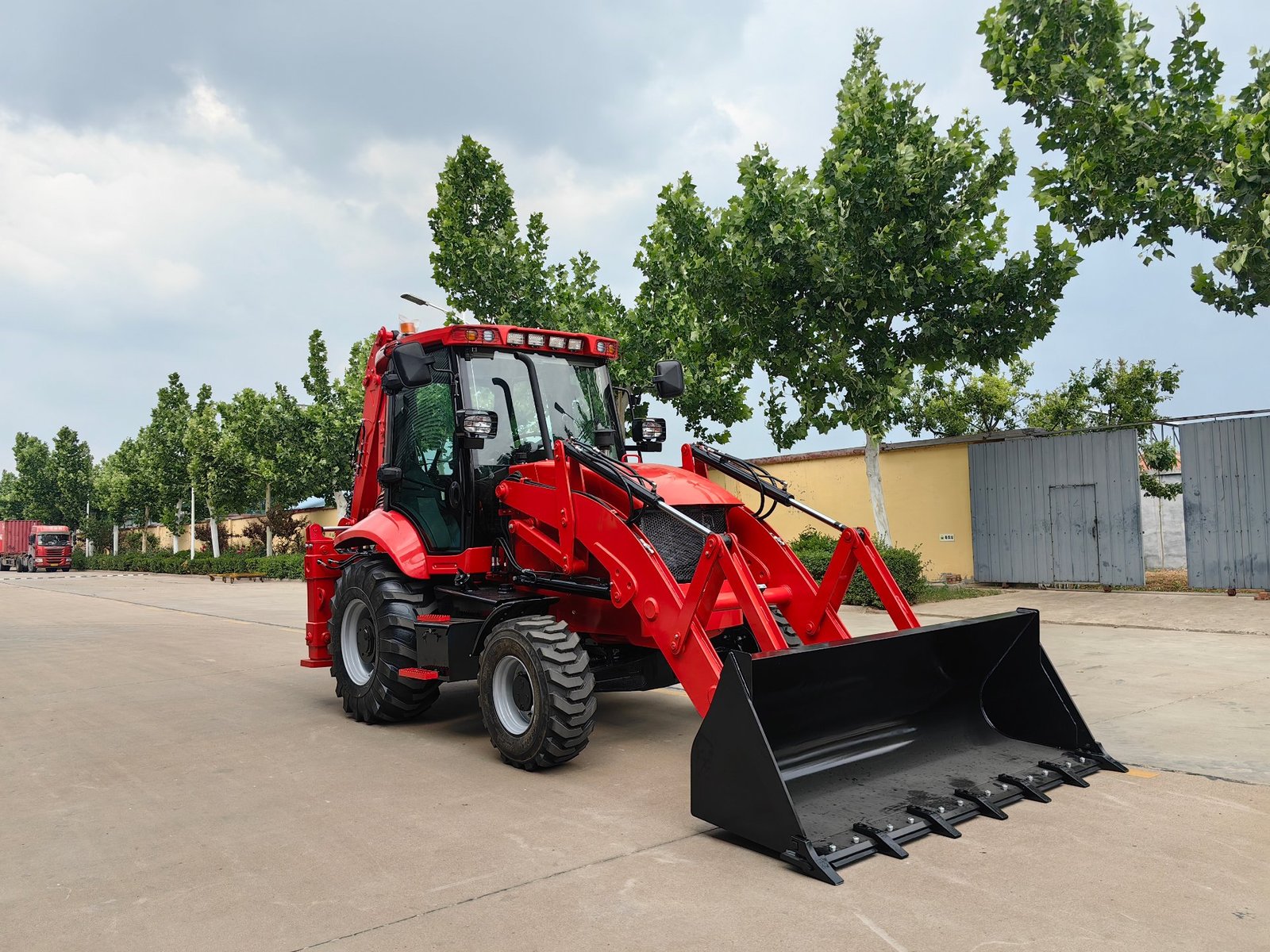 Backhoe loader ready for export — the machine your payment is buying